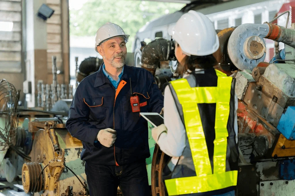 Director Of Maintenance Talking With A Factory Worker