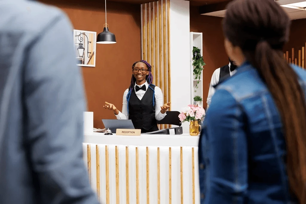 Friendly Hotel Receptionist Assisting Visitors