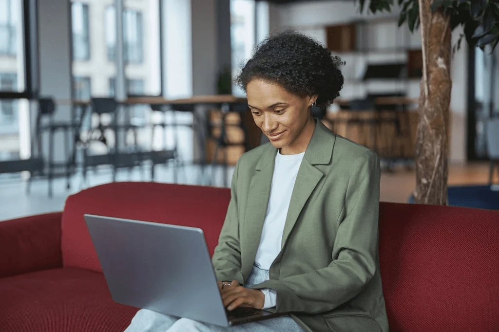 Job Seeker Navigating An Online Job Search Site Using Her Laptop