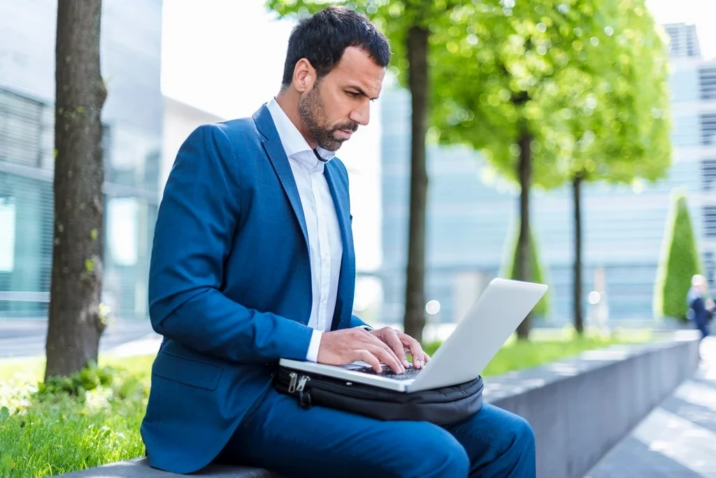 Job Seeker Using His Laptop To Search For A Vacancy