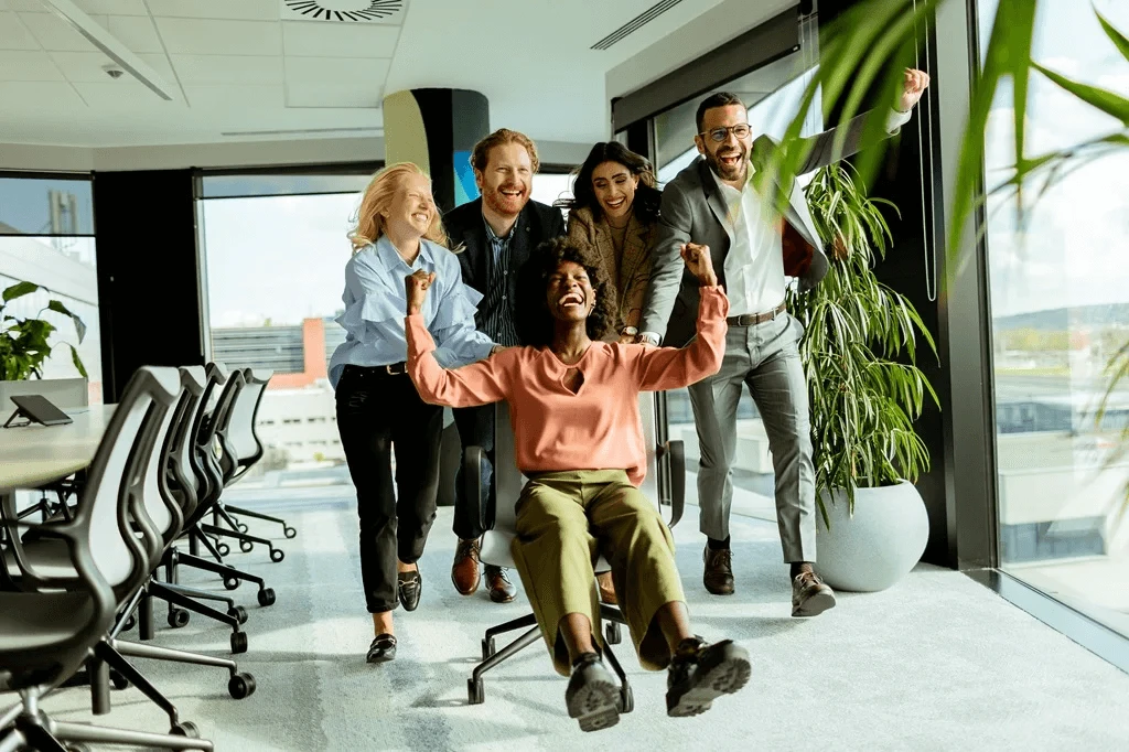 Joyful Office Colleagues Having Fun After A Stressful Day