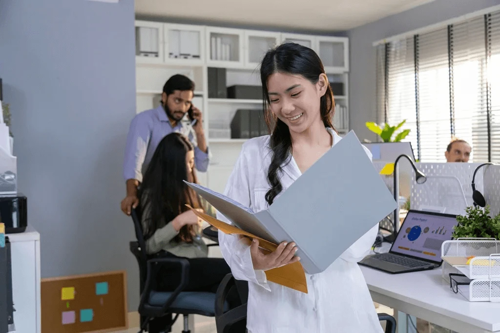 Office Employee Holding Confidential Business Information