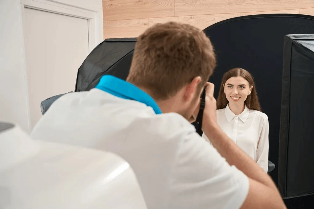 Photographer Capturing Professional Headshots Of A Job Seeker