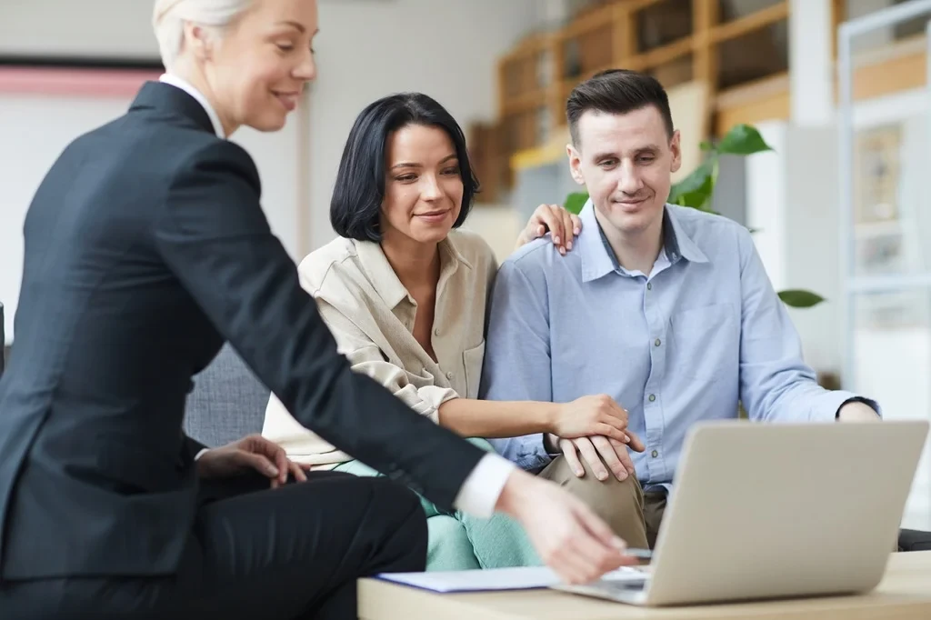 Sales Representative Showing A Presentation To A Potential Client