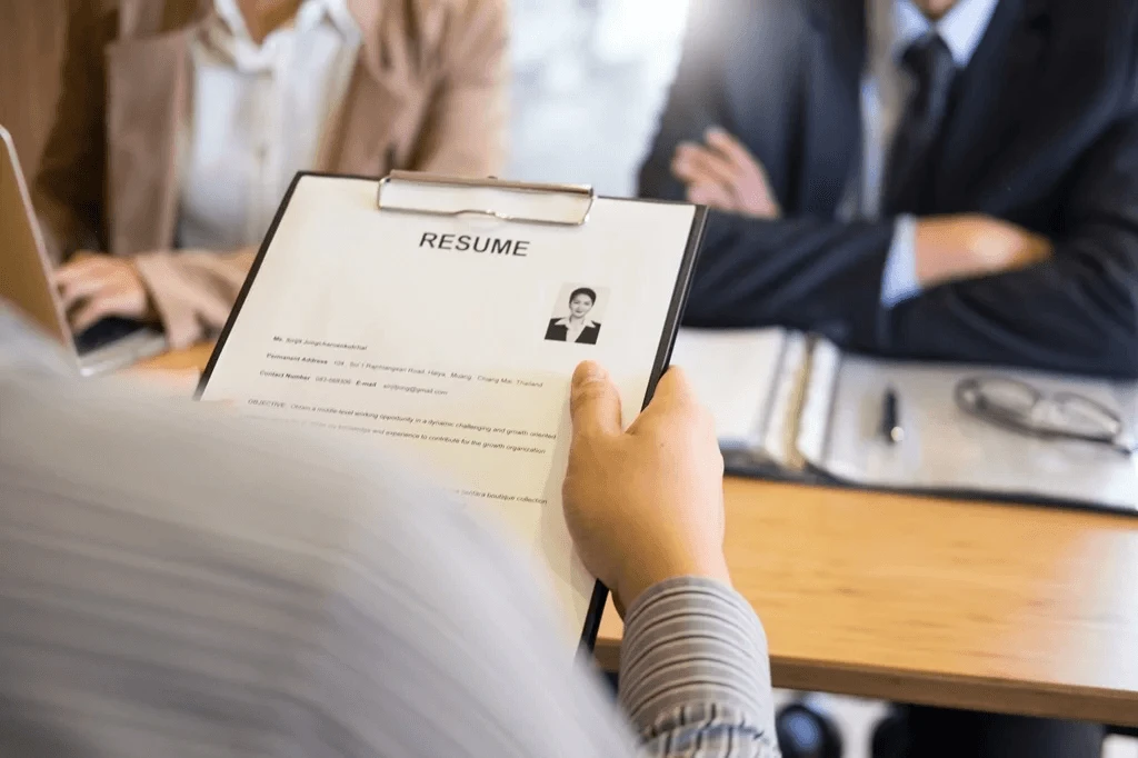 School Director Reading A Student Resume