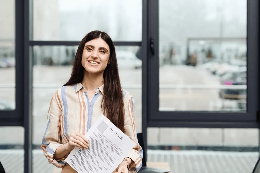 University Student Holding A Resume