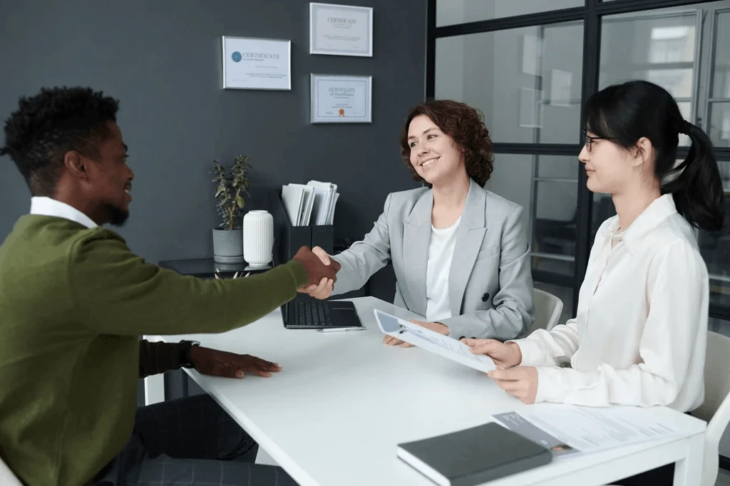 Applicant Shaking The Hand Of The Recruiter During The Interview