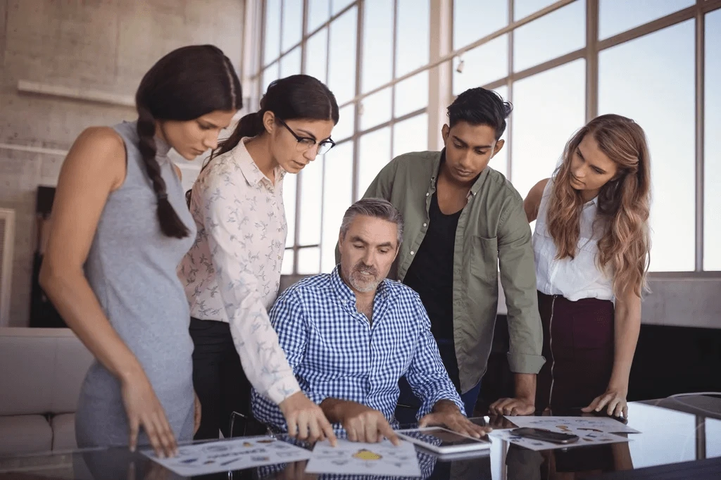 Brand Manager Giving Project Instructions To His Team