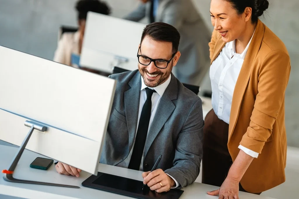 Business Administrator Reviewing The Work Of An Employee