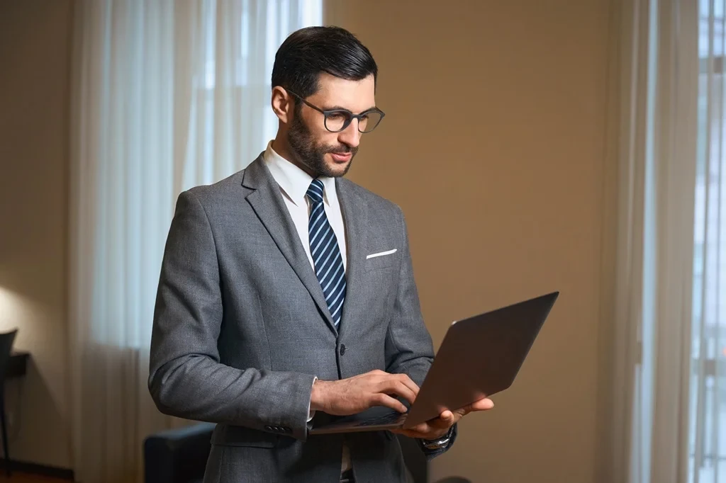 Business Administrator Working On A Laptop To Manage Tasks And Projects