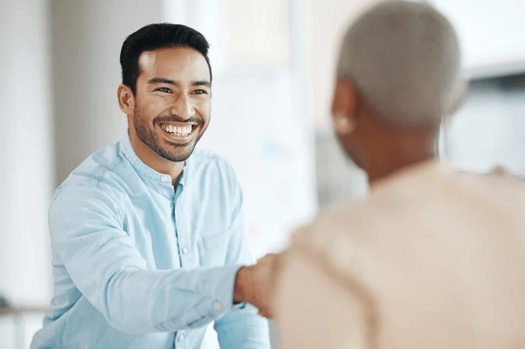 Employee Shaking The Hands Of His Mentor Who Gave Him Career Advice