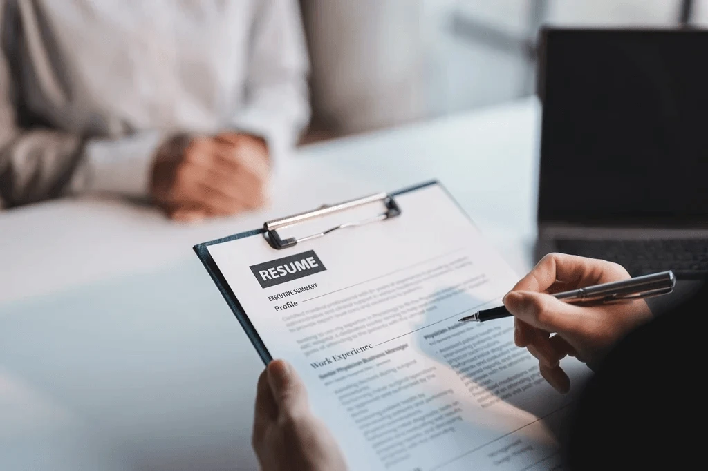 Head Hunter Checking The Resume Of An Applicant