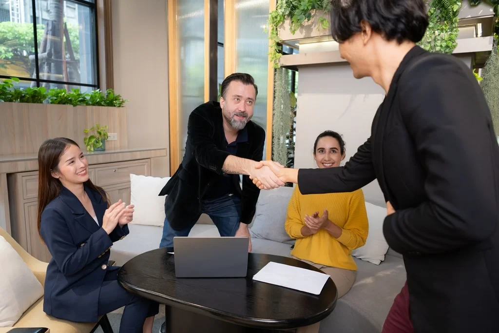 Hiring Manager Congratulating The Newly Hired Employee