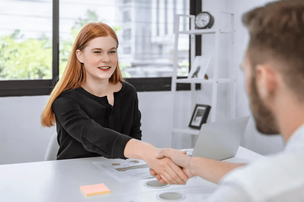 Job Applicant Exchanging Handshakes With The Employer During An Interview