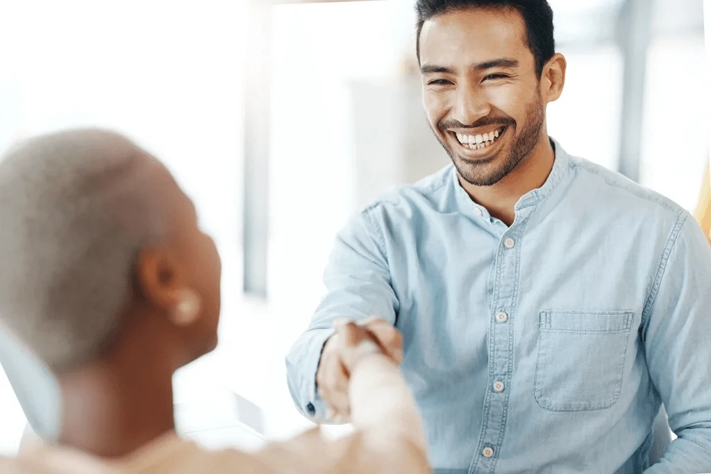 Job Applicant Having A Firm Handshake With The Interviewer