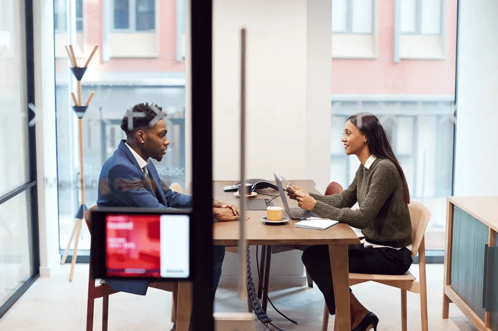 Job Seeker Attending A Mock Interview In A Conference Room