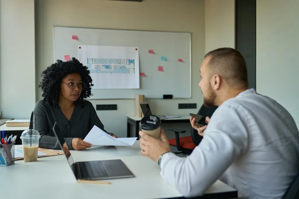 Job Seeker Listening To The Advice Of A Mentor After Their Mock Interview