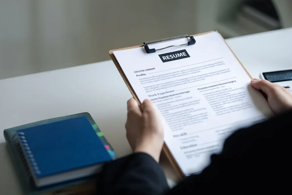 Job Seeker Reviewing His Resume To Identify And Fix Any Errors