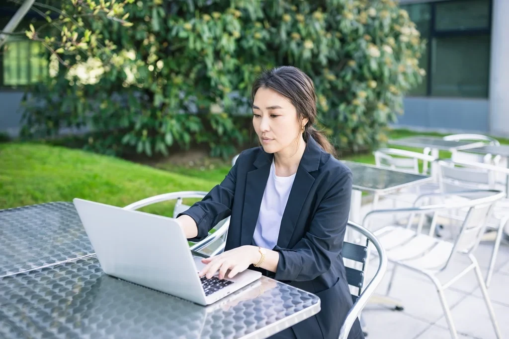 Job Seeker Working On The Resume Headings Of Her Resume