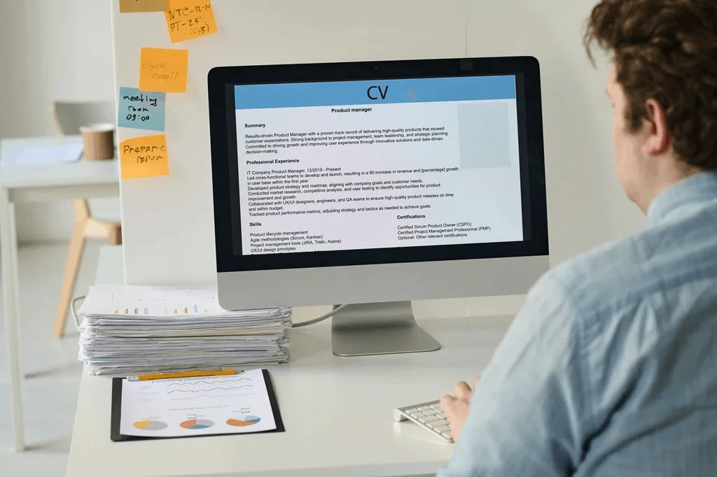 Recruiter Checking Resumes Using His Computer