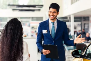 Sales Associate Assisting A Customer Choosing A Car