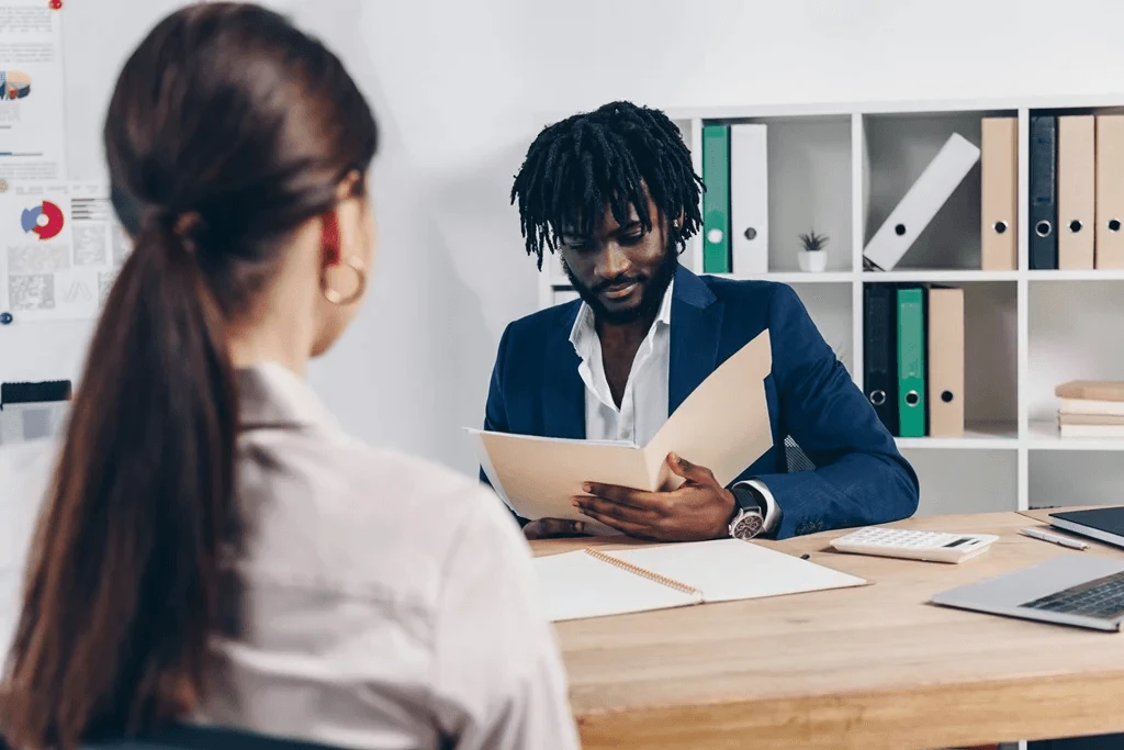 An Employer Reviewing The Education Section Of A Resume