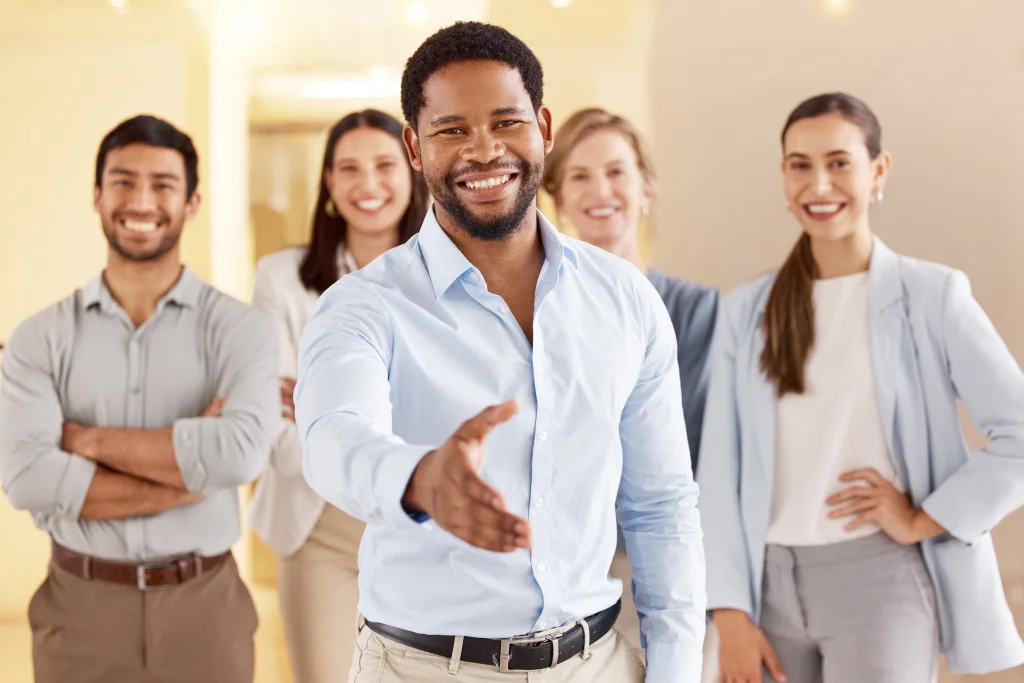 Business Man Stretching Hand For Handshake In Office