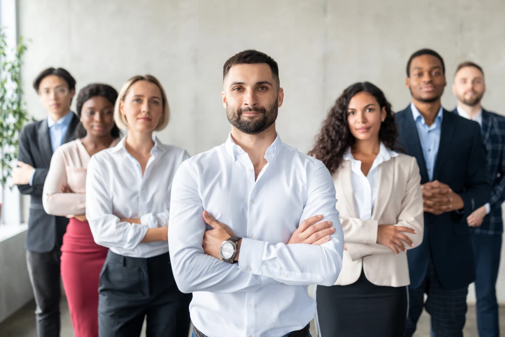 Businessman Standing In Front Of Multiracial Business Team Indoor