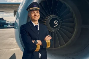 Cheerful Aviator Posing For The Camera After The Flight