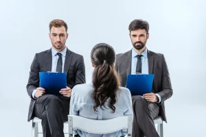 Confident Businessmen Interviewing A Woman