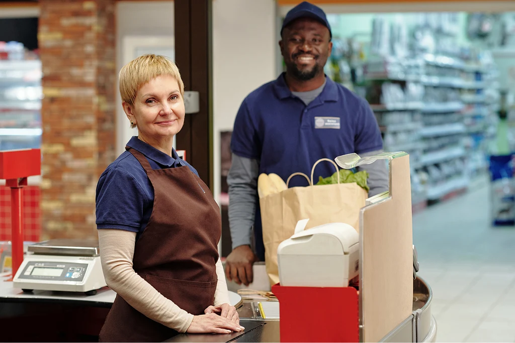 Intercultural Staff Of Supermarket In Uniform