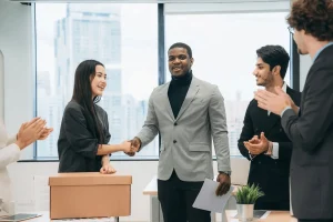 Professional Being Welcomed In His New Job