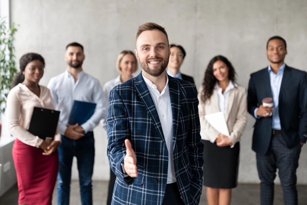 Smiling Businessman Stretching Hand For Handshake