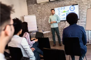 Young Business People Meeting In An Office Focusing On His Presentation Skills