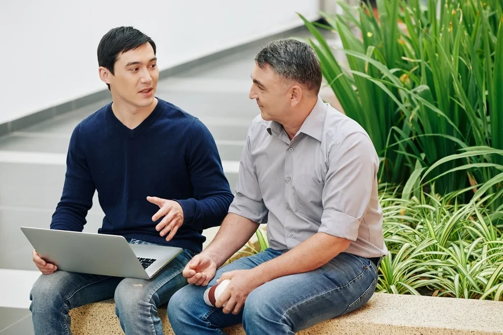 Employee Asking Advice From His Mentor On How To Handle New Tasks