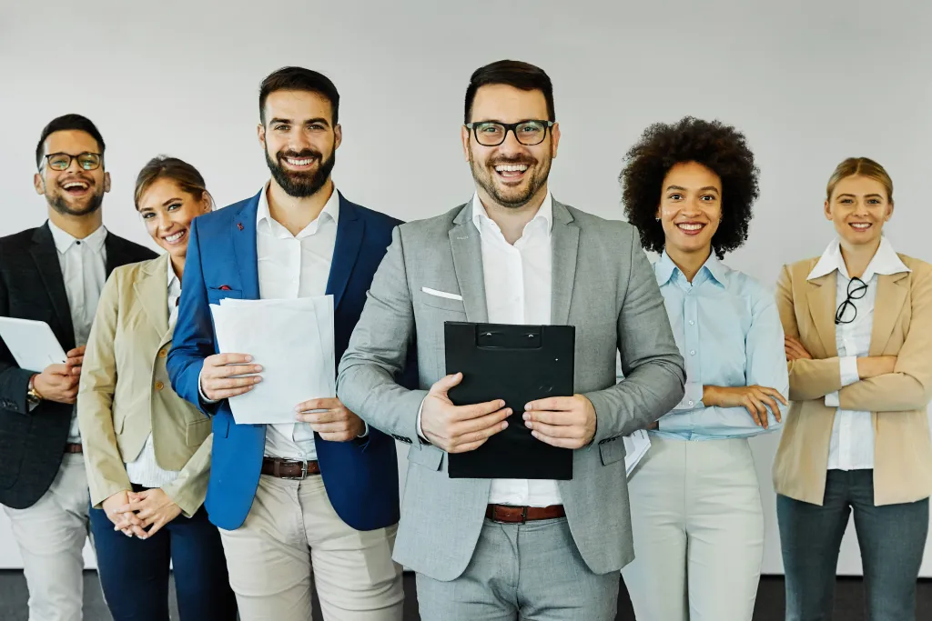 Group Of Young Business People Posing In The Office