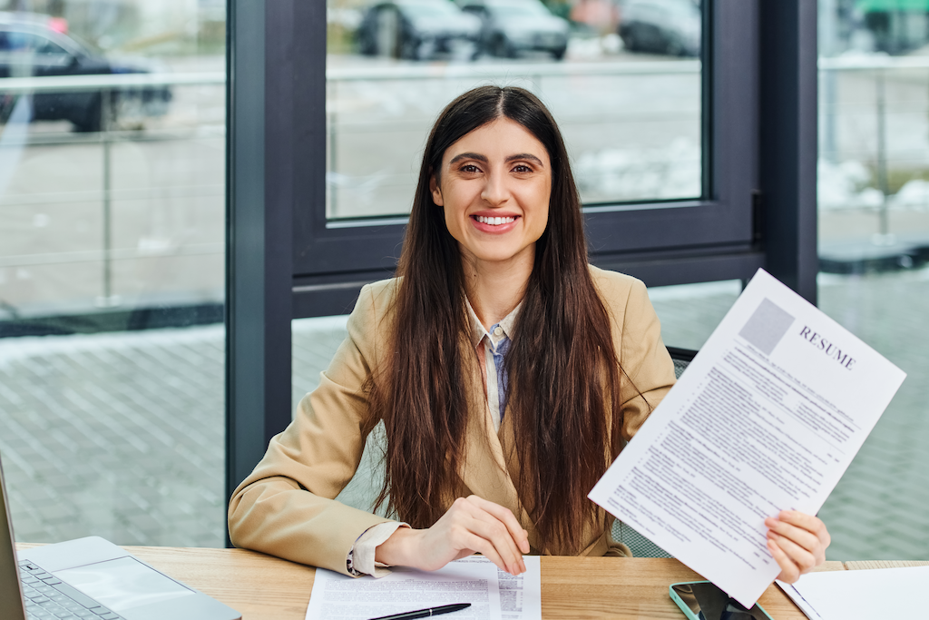 Woman Engrossed In Work Holding Resume